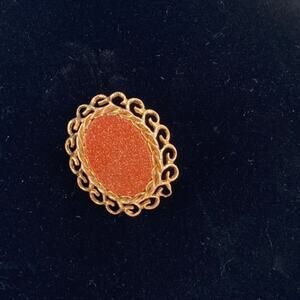 Vintage red goldstone cameo style art deco brooch